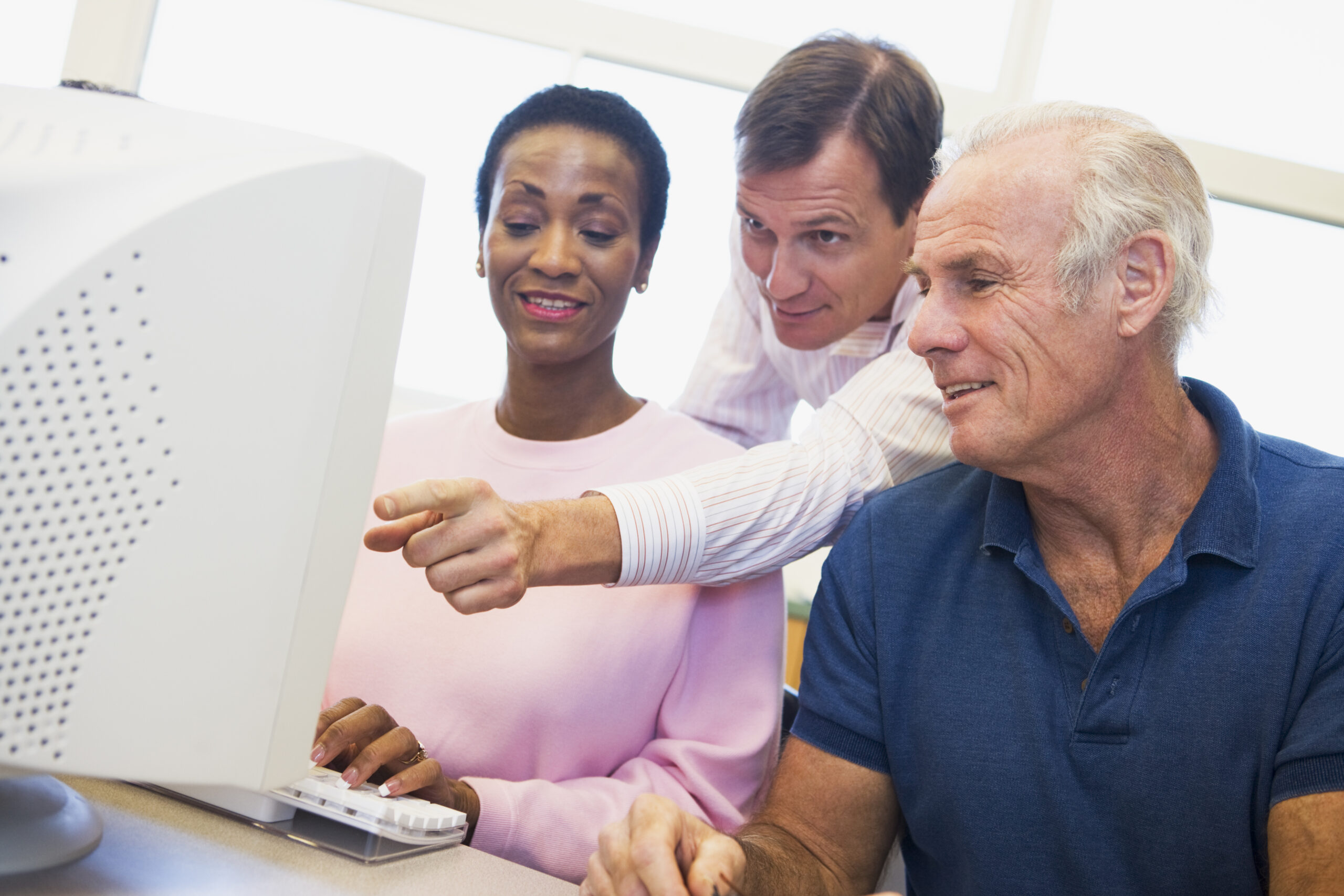 Mature students learning computer skills
